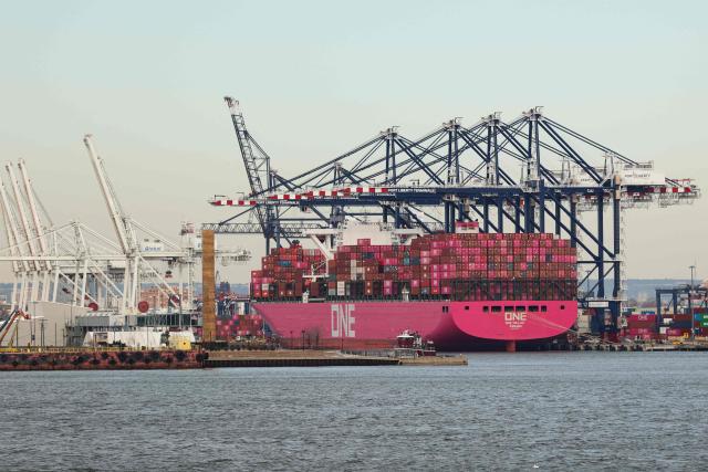 Cargo ships and shipping containers are seen at the Port Jersey container terminal in Jersey City, New Jersey on January 23, 2026. (Photo by CHARLY TRIBALLEAU / AFP)