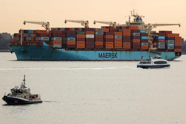 A Maersk cargo ship loaded with shipping containers navigates through New York Bay on January 23, 2026. (Photo by CHARLY TRIBALLEAU / AFP)