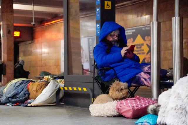 People take shelter at a metro station during an air attack in Kyiv on January 24, 2026, amid the Russian invasion of Ukraine. Russian strikes injured at least 15 people in Ukraine's capital and the northeastern city of Kharkiv overnight, authorities said early on January 24. (Photo by Serhii Okunev / AFP)