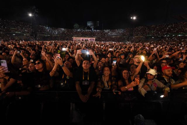 Fans enjoy the concert of Puerto Rican rapper Bad Bunny during his "Debi tirar mas fotos" world tour at the Atanasio Girardot Stadium in Medellin, Colombia, on January 23, 2026. (Photo by Jaime SALDARRIAGA / AFP)