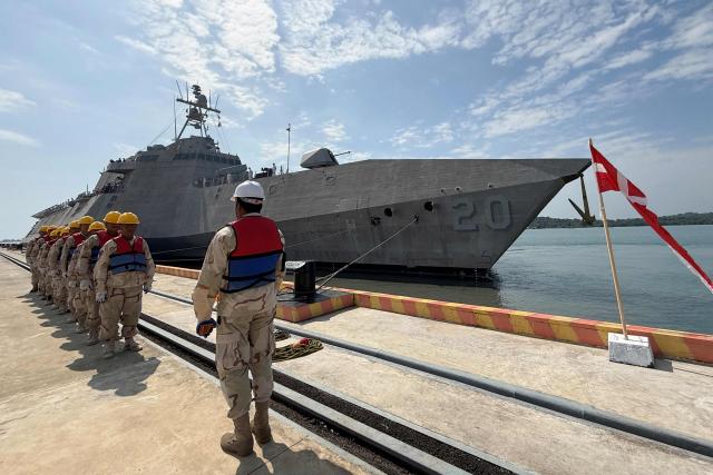 Royal Cambodian Navy personnel stand in formation as they welcome the US Navy's USS Cincinnati (LCS-20) littoral combat ship for a port call at the Ream Naval base, located in Cambodia's southern coast in Preah Sihanouk province, on January 24, 2026. (Photo by Suy SE / AFP)