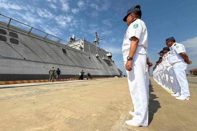 Royal Cambodian Navy personnel stand in formation as they welcome the US Navy's USS Cincinnati (LCS-20) littoral combat ship for a port call at the Ream Naval base, located in Cambodia's southern coast in Preah Sihanouk province, on January 24, 2026. (Photo by Suy SE / AFP)