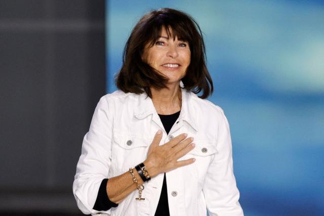 (FILES) French fashion designer Veronique Nichanian greets the audience at the end of the Hermes Spring/Summer 2025 menswear ready to wear collection show, as part of Paris Fashion Week in Paris, on June 22, 2024. French designer Veronique Nichanian will present her latest Hermes collection on January 24, 2026 after 37 years at the helm of the men's collections. (Photo by Geoffroy VAN DER HASSELT / AFP)