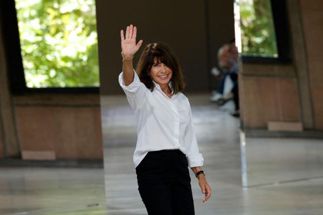 (FILES) French fashion designer Veronique Nichanian waves to the audience at the end of the  Hermes Menswear Spring-Summer 2026 collection show as part of the Paris Fashion Week at Place d'Iena in Paris, on June 28, 2025. French designer Veronique Nichanian will present her latest Hermes collection on January 24, 2026 after 37 years at the helm of the men's collections. (Photo by GEOFFROY VAN DER HASSELT / AFP)