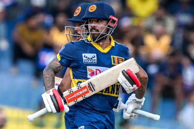 Sri Lanka's Kusal Mendis (front) and Pathum Nissanka run between the wickets during the second one-day international (ODI) cricket match between Sri Lanka and England at the R. Premadasa International Cricket Stadium in Colombo on January 24, 2026. (Photo by Ishara S. KODIKARA / AFP)