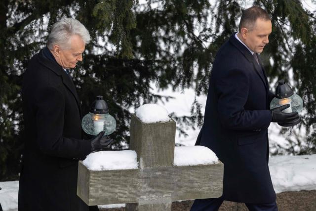 Lithuania's President Gitanas Nauseda (L) and Poland's President Karol Nawrocki (R) take part in ceremonies marking the 163th anniversary of January Uprising - a Polish-led insurrection in 1863–1864 against the Russian Empire, at the Execution Gate at the 19th century Warsaw Citadel on January 24, 2025. (Photo by Wojtek RADWANSKI / AFP)
