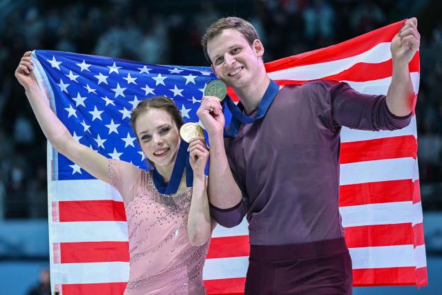 USA's Alisa Efimova (L) and Misha Mitrofanov celebrate with their medals after winning the pairs competition at the ISU Four Continents Figure Skating Championships in Beijing on January 24, 2026. (Photo by GREG BAKER / AFP)