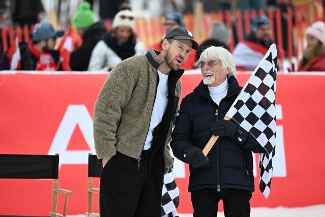 British business magnate, motorsport executive and former racing driver Bernie Ecclestone (R) and former German F1 racing driver Sebastian Vettel attend the "KitzCharityRace 2026" event on the sideline of the FIS Alpine Skiing World Cup in Kitzbuhel, Austria, on January 24, 2026. (Photo by BARBARA GINDL / APA / AFP) / Austria OUT