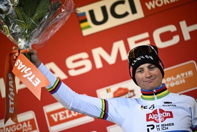Dutch Mathieu van rer Poel celebrates on the podium after winning the men's elite race of the UCI World Cup cyclocross event in Maasmechelen on January 24, 2026. (Photo by JASPER JACOBS / Belga / AFP) / Belgium OUT