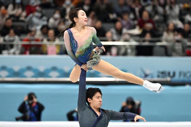 China’s Sui Wenjing (top) and Han Cong compete in the pairs free skating at the ISU Four Continents Figure Skating Championships in Beijing on January 24, 2026. (Photo by GREG BAKER / AFP)
