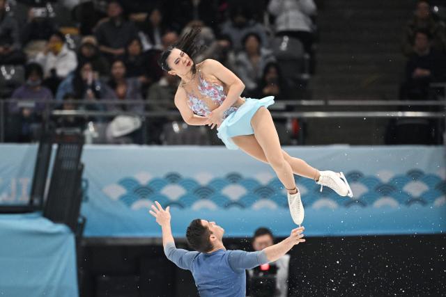 US' Audrey Shin (top) and Balazs Nagy compete in the pairs free skating at the ISU Four Continents Figure Skating Championships in Beijing on January 24, 2026. (Photo by GREG BAKER / AFP)