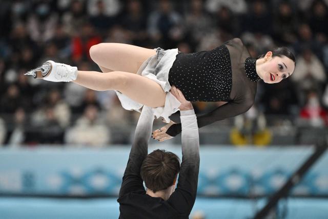 US' Katie McBeath (top) and Daniil Parkman compete in the pairs free skating at the ISU Four Continents Figure Skating Championships in Beijing on January 24, 2026. (Photo by GREG BAKER / AFP)