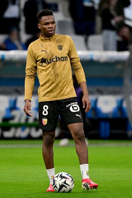 Lens' Malian midfielder #08 Mamadou Sangare warms up ahead of the French L1 football match between Olympique de Marseille (OM) and RC Lens at the Stade Velodrome in Marseille, southern France, on January 24, 2026. (Photo by Miguel MEDINA / AFP)