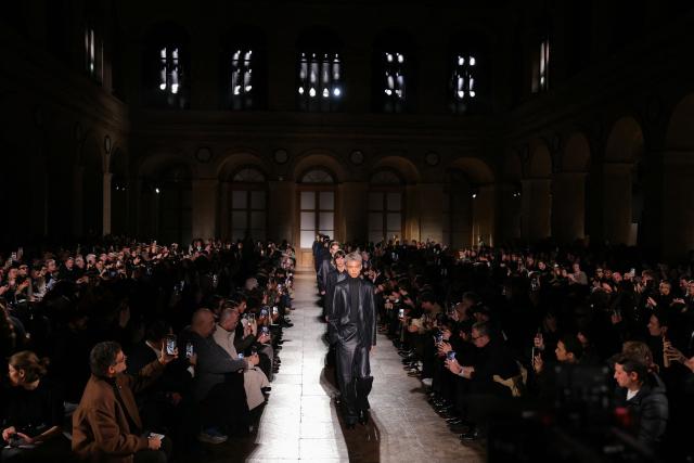 Models present creations by Hermes for the Menswear Ready-to-wear Fall-Winter 2026/2027 collection as part of the Men Paris Fashion Week in Paris on January 24, 2026.  (Photo by Thomas SAMSON / AFP)