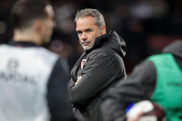 Toulouse's French coach Ugo Mola looks on during the warm up ahead of the French Top14 rugby union match between Stade Toulousain Rugby (Toulouse) and Section Paloise Bearn Pyrenees (Pau) at the Ernest-Wallon stadium in Toulouse, south-western France, on January 24, 2026. (Photo by Valentine CHAPUIS / AFP)