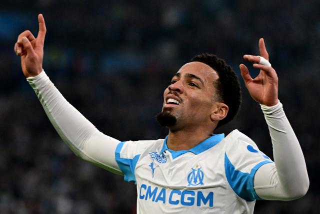 Marseille's English midfielder #11 Ethan Nwaneri celebrates after scoring a goal during the French L1 football match between Olympique de Marseille (OM) and RC Lens at the Stade Velodrome in Marseille, southern France, on January 24, 2026. (Photo by Miguel MEDINA / AFP)