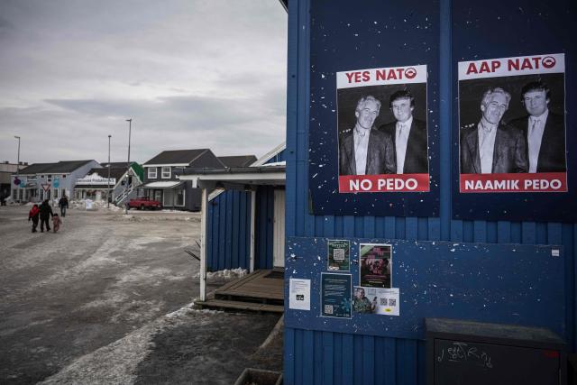 A poster showing Jeffrey Epstein and US President Donald Trump with the text “YES NATO NO PEDO” is displayed on a wall in Nuuk, Greenland, on January 24, 2026. (Photo by Jonathan NACKSTRAND / AFP)