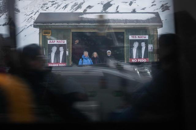 A poster showing Jeffrey Epstein and US President Donald Trump with the text in Greenlandic and English “YES NATO NO PEDO” is displayed on a bus stop shelter in Nuuk, Greenland, on January 24, 2026. (Photo by Jonathan NACKSTRAND / AFP)