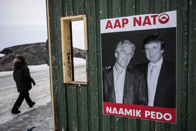 A poster showing Jeffrey Epstein and US President Donald Trump with the text in Greenlandic “YES NATO NO PEDO” is displayed on a bus stop shelter in Nuuk, Greenland, on January 24, 2026. (Photo by Jonathan NACKSTRAND / AFP)