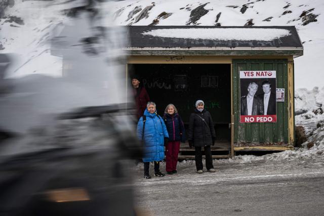 A poster showing Jeffrey Epstein and US President Donald Trump with the text in Greenlandic and English “YES NATO NO PEDO” is displayed on a bus stop shelter in Nuuk, Greenland, on January 24, 2026. (Photo by Jonathan NACKSTRAND / AFP)