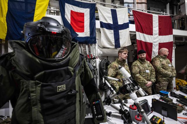 Military equipment, is displayed during an open day aboard the Royal Danish Navy patrol vessel HDMS Vædderen (F359) in Nuuk, Greenland, on January 24, 2026. HDMS (His Danish Majesty's Ship) Vaedderen (F359) is a Thetis-class ocean patrol vessel of the Royal Danish Navy. The vessel is employed to exercise Danish sovereignty in waters around the Faroe Islands and Greenland. (Photo by Jonathan NACKSTRAND / AFP)