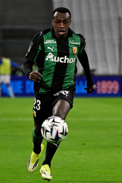 Lens' Saudi Arabian defender #23 Saud Abdulhamid runs for the ball during the French L1 football match between Olympique de Marseille (OM) and RC Lens at the Stade Velodrome in Marseille, southern France, on January 24, 2026. (Photo by Miguel MEDINA / AFP)