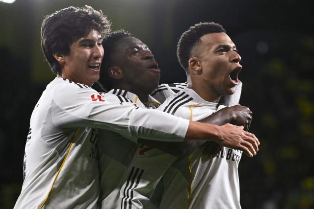 Real Madrid's French forward #10 Kylian Mbappe celebrates scoring his team's second goal from the penalty spot during the Spanish league football match between Villarreal CF and Real Madrid CF at La Ceramica Stadium in Vila-Real on January 24, 2026. (Photo by JOSE JORDAN / AFP)