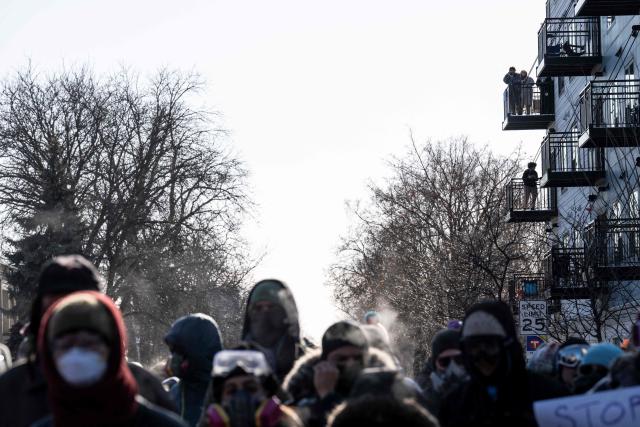 Protesters gather near where a man was shot dead by federal immigration agents in Minneapolis, Minnesota, on January 24, 2026. Federal immigration agents shot dead a man in Minneapolis on Saturday, officials said -- the second fatal shooting of a civilian in the city, sparking fresh protests and outrage from state officials. The death came less than three weeks after US citizen Renee Good was shot and killed by an Immigration and Customs Enforcement officer involved in sweeps to round up undocumented migrants. (Photo by ROBERTO SCHMIDT / AFP)