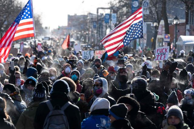 Protesters gather near where a man was shot dead by federal immigration agents in Minneapolis, Minnesota, on January 24, 2026. Federal immigration agents shot dead a man in Minneapolis on Saturday, officials said -- the second fatal shooting of a civilian in the city, sparking fresh protests and outrage from state officials. The death came less than three weeks after US citizen Renee Good was shot and killed by an Immigration and Customs Enforcement officer involved in sweeps to round up undocumented migrants. (Photo by ROBERTO SCHMIDT / AFP)