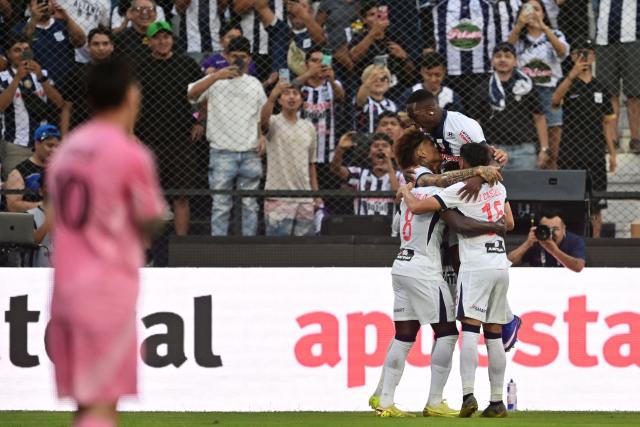 Alianza Lima's forward #34 Paolo Guerrero (unseen) celebrates with teammates scoring his team's second goal during the friendly football match between Peru's Alianza Lima and the US' Inter Miami at the Alejandro Villanueva Stadium in Lima on January 24, 2025. (Photo by Connie FRANCE / AFP)