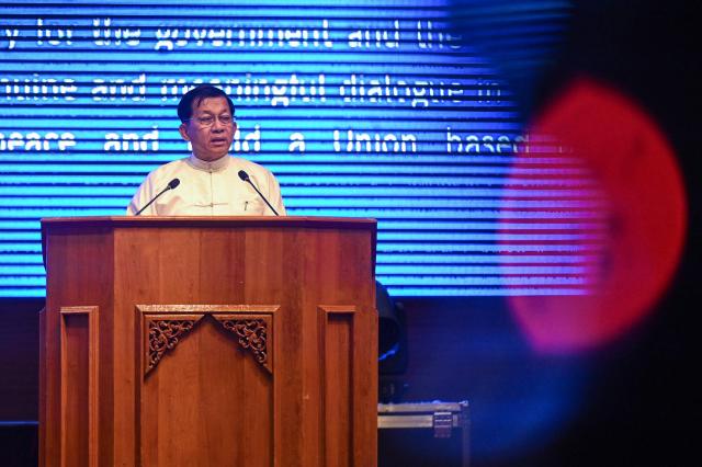 (FILES) Myanmar's junta chief Min Aung Hlaing delivers a speech during a ceremony to mark the 10th anniversary of the Nationwide Ceasefire Agreement (NCA) in Naypyidaw on October 15, 2025. Myanmar's top general Min Aung Hlaing was months from retirement five years ago when he made an about-face, deposed the democratic government and promoted himself to leader. The bespectacled officer became military chief in 2011, just as Myanmar broke with its history of iron-fisted martial rule and began its latest experiment with democracy. (Photo by AFP)