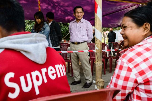 Military chief Min Aung Hlaing (C) visits a polling station during the third and final phase of Myanmar's general election in Mandalay on January 25, 2026. (Photo by ANTHONY WALLACE / AFP)