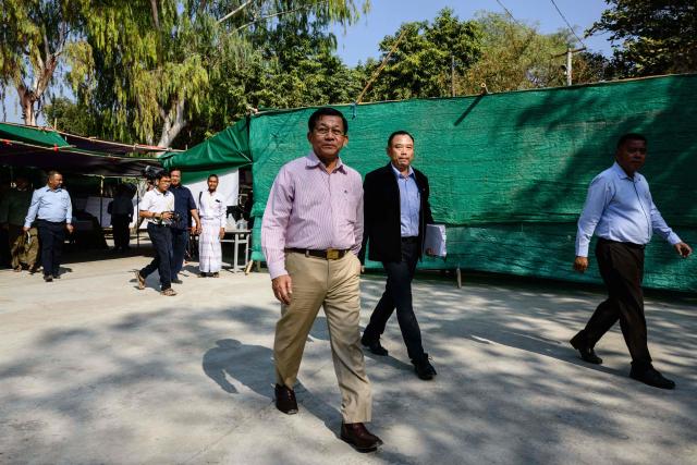 Military chief Min Aung Hlaing (C) visits a polling station during the third and final phase of Myanmar's general election in Mandalay on January 25, 2026. (Photo by ANTHONY WALLACE / AFP)