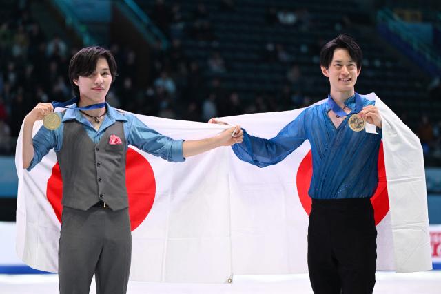 Gold medallist Japan’s Kao Miura (L) and bronze medallist Japan’s Sota Yamamoto pose with their medals after the men's competition at the ISU Four Continents Figure Skating Championships in Beijing on January 25, 2026. (Photo by GREG BAKER / AFP)