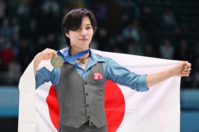 Gold medallist Japan’s Kao Miura poses with his medal after winning the men's competition at the ISU Four Continents Figure Skating Championships in Beijing on January 25, 2026. (Photo by GREG BAKER / AFP)