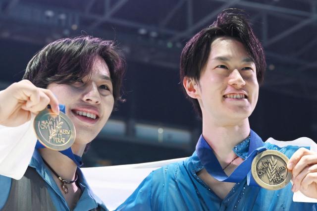 Gold medallist Japan’s Kao Miura (L) and bronze medallist Japan’s Sota Yamamoto pose with their medals after the men's competition at the ISU Four Continents Figure Skating Championships in Beijing on January 25, 2026. (Photo by GREG BAKER / AFP)