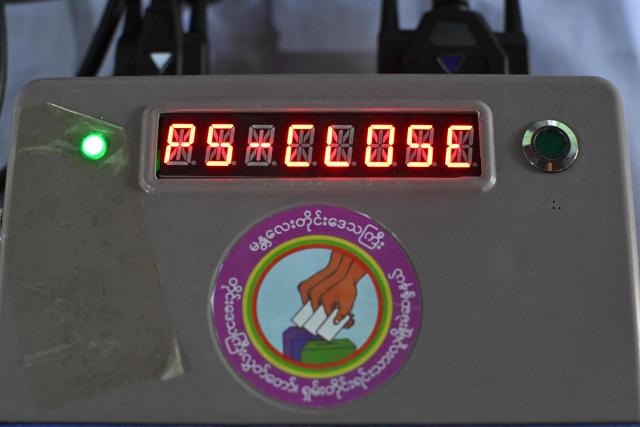 A polling station voting machine indicates the close of voting for the third and final phase of Myanmar's general election in Mandalay on January 25, 2026. (Photo by Anthony WALLACE / AFP)