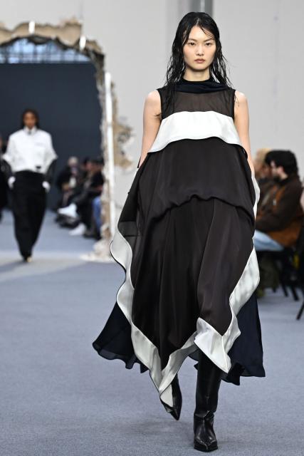 A model presents a creation by Sacai for the Menswear Ready-to-wear Fall-Winter 2026/2027 collection as part of the Men Paris Fashion Week in Paris on January 25, 2026.  (Photo by Blanca CRUZ / AFP)