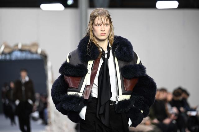 A model presents a creation by Sacai for the Menswear Ready-to-wear Fall-Winter 2026/2027 collection as part of the Men Paris Fashion Week in Paris on January 25, 2026.  (Photo by Blanca CRUZ / AFP)
