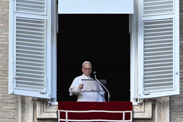 Pope Leo XIV delivers his speech from the window of the apostolic palace overlooking St. Peter's square during the Angelus prayer in the Vatican on January 25, 2026. (Photo by Andreas SOLARO / AFP)