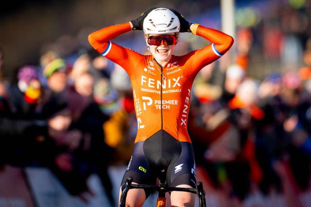 Ducth rider Puck Pieterse celebrates as she crosse the finish line to win the Women's Elite UCI Cyclocross World Cup in Hoogerheide on January 25, 2026. (Photo by Iris van den Broek / ANP / AFP) / Netherlands OUT