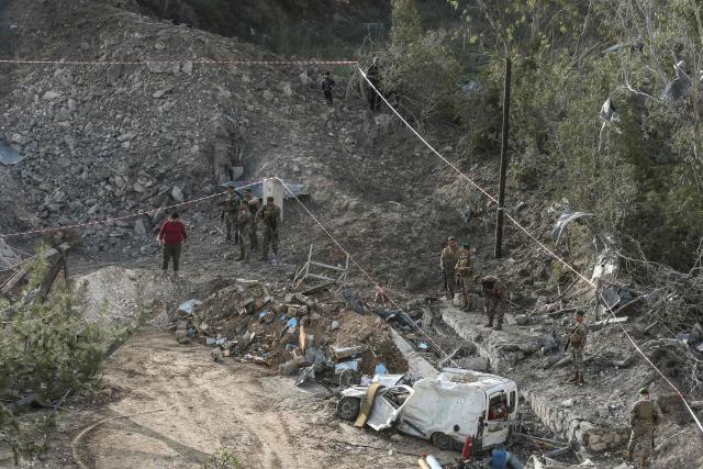 Lebanese soldiers inspect the scene following an Israeli airstrike that targeted a building in the southern Lebanese village of Kfar Dounine on January 25, 2026. An Israeli strike on south Lebanon killed one person on Janauary 25, the health ministry reported, as Israel's military said it struck Hezbollah targets. More than 350 people have been killed by Israeli fire in Lebanon despite the November 2024 truce, according to an AFP tally of health ministry reports. (Photo by MAHMOUD ZAYYAT / AFP)