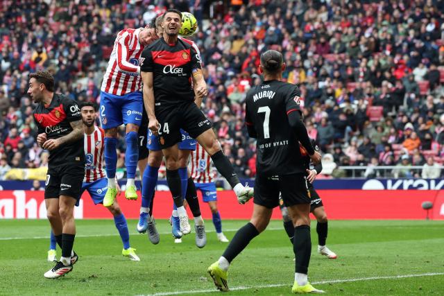 Atletico Madrid's Uruguayan defender #02 Jose Gimenez (TOP L), Atletico Madrid's Norwegian forward #09 Alexander Sorloth (TOP C) and Real Mallorca's Slovak defender #24 Martin Valjent (TOP R) vie for a header during the Spanish league football match between Club Atletico de Madrid and RCD Mallorca at Metropolitano Stadium in Madrid on January 25, 2026. (Photo by Pierre-Philippe MARCOU / AFP)