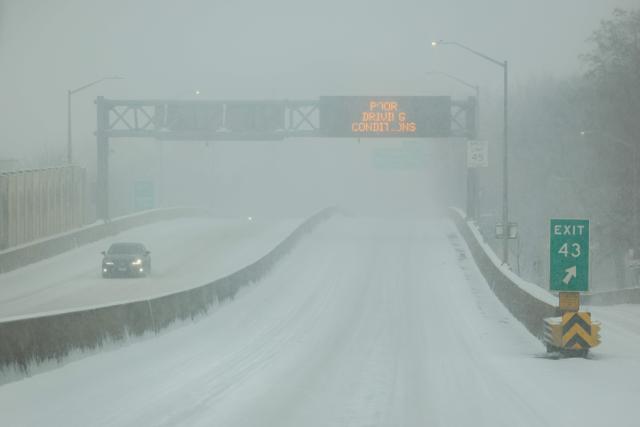 A snow covered highway is seen in the Queens borough of New York City on January 25, 2026. A massive winter storm on January 24 dumped snow and freezing rain from New Mexico to North Carolina as it swept across the United States towards the northeast, threatening tens of millions of Americans with blackouts, transportation chaos and bone-chilling cold. After battering the country's southwest and central areas, the storm system began to hit the heavily populated mid-Atlantic and northeastern states as a frigid air mass settled in across the nation. (Photo by CHARLY TRIBALLEAU / AFP)
