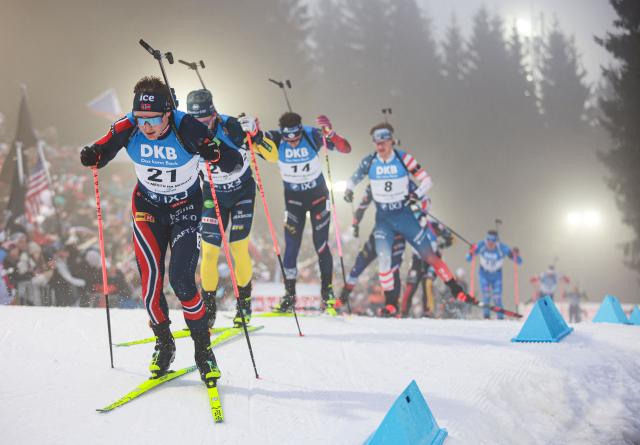 Norway's Sverre Aspenes (L) competes in the men's 15 km mass start competition of the IBU Biathlon World Cup in Nove Mesto, Czech Republic, on January 25,  2026. (Photo by Radek MICA / AFP)