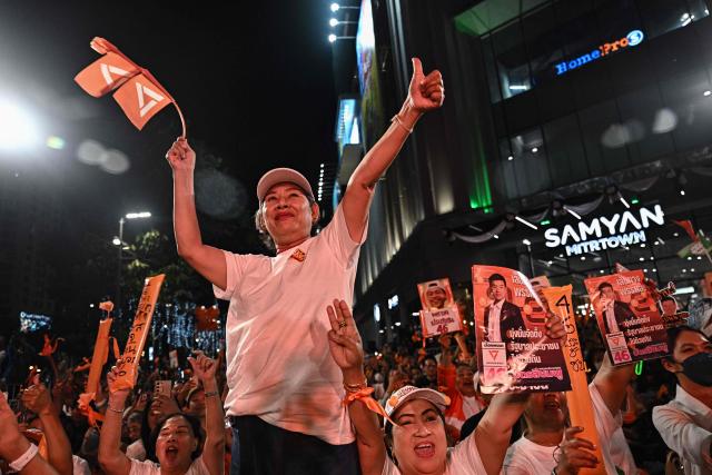 Supporters of People's Party leader and prime ministerial candidate Natthaphong Ruengpanyawut cheer during a campaign rally ahead of the general election in Bangkok on January 25, 2026. (Photo by Lillian SUWANRUMPHA / AFP)