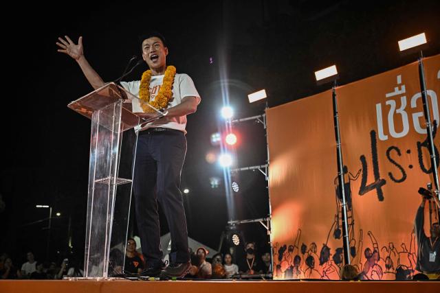 People's Party leader and prime ministerial candidate Natthaphong Ruengpanyawut addresses a rally ahead of the general election in Bangkok on January 25, 2026. (Photo by Lillian SUWANRUMPHA / AFP)