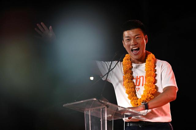 People's Party leader and prime ministerial candidate Natthaphong Ruengpanyawut addresses a rally ahead of the general election in Bangkok on January 25, 2026. (Photo by Lillian SUWANRUMPHA / AFP)