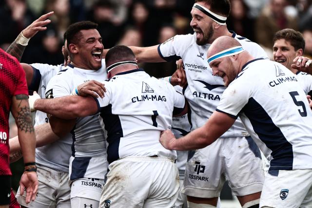 Montpellier’s French prop Wilfrid Hounkpatin (L) celebrates with teammates after scoring a try during the French Top 14 rugby union match between Rugby Club Toulonnais (Toulon) and Montpellier Herault Rugby at the Stade Mayol in Toulon, south-eastern France on January 25, 2026. (Photo by Thibaud MORITZ / AFP)