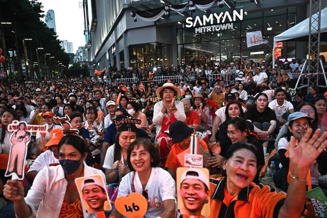 People’s Party supporters cheer during a campaign rally ahead of the general election, in Bangkok on January 25, 2026. (Photo by Lillian SUWANRUMPHA / AFP)